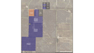 Aerial map showing multiple land parcels with colored overlays: large purple areas labeled "158 Acres Industrial Available" and "105 Acres Industrial Available," a smaller orange area labeled "30 Acres Commercial Available," a gray area labeled "25ac Under Contract," and several tiny sold parcels. Roads form a grid, with a north–south road along the right side and lots outlined in yellow-green borders.