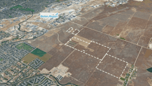Aerial view of Boise Airport area with white dashed outlines marking several land parcels slated for development near the airport.
