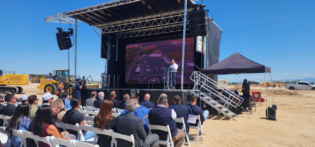 Speaker on a stage at The District at Ten Mile's ceremony