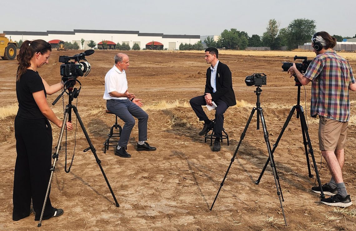 Michael Adler talking with CNBC interviewer.